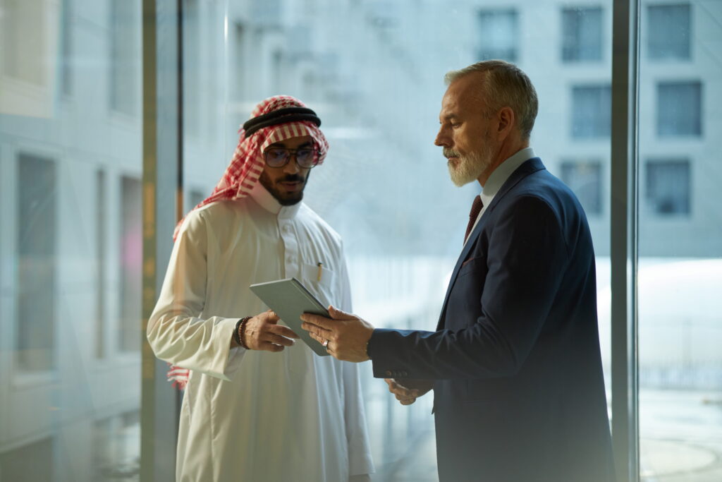 two diverse businessmen checking data digital tablet (1).jpg